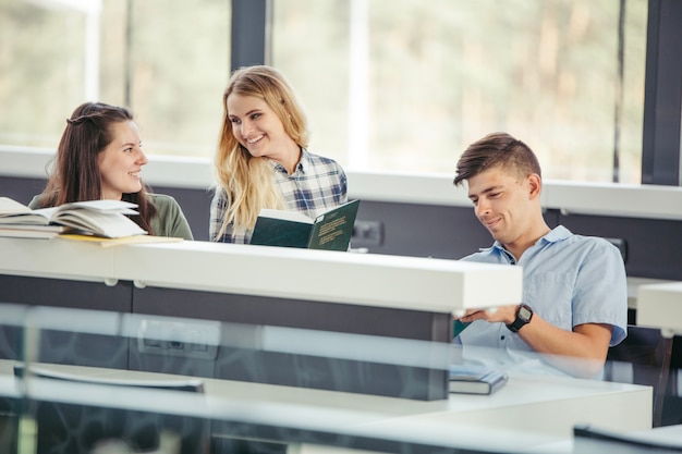 Free photo classmates reading in college