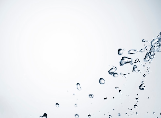 Free photo clean water drops on light background