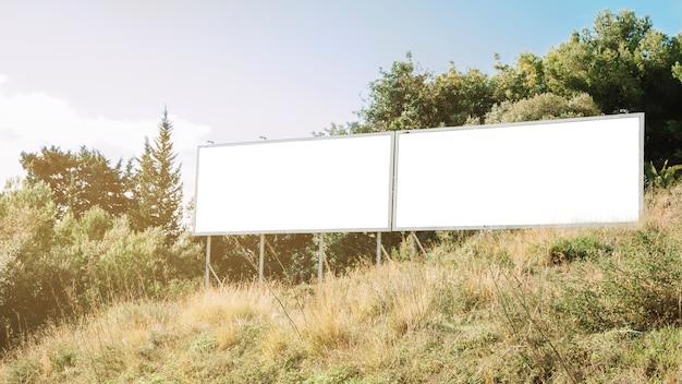 Clean white billboards on green slope