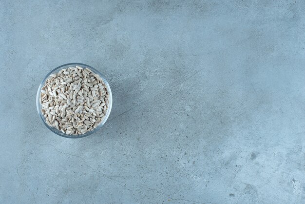 Cleaned sunflower seeds in a glass cup. High quality photo