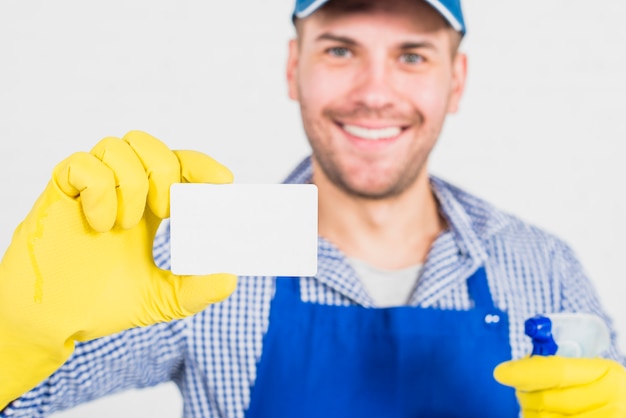 Free Photo cleaning concept with man showing business card