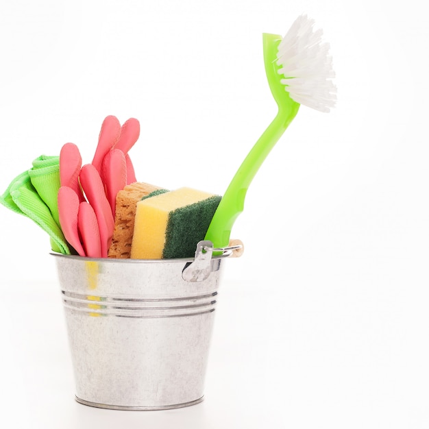 Free Photo cleaning sponges in a silver pail