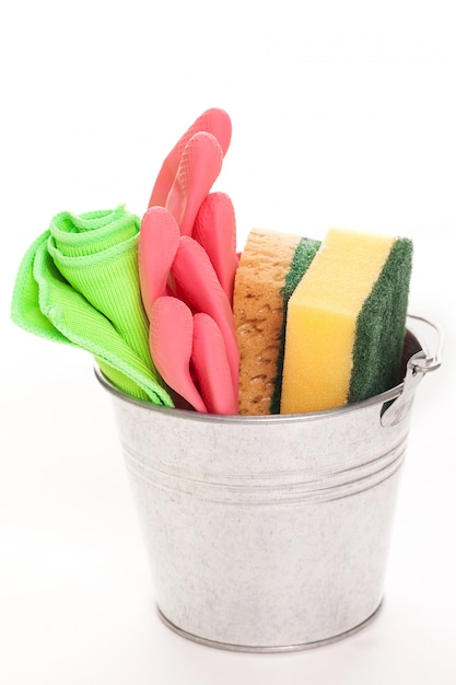 Cleaning sponges in a silver pail