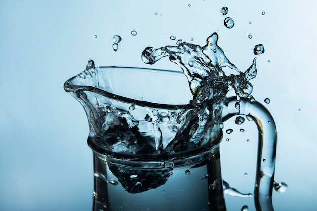 Clear jug with splashing water