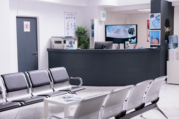 Free photo clinical reception with waiting room in facility lobby, registration counter used for patients with medical appointments. empty reception desk in health center for checkup visits.