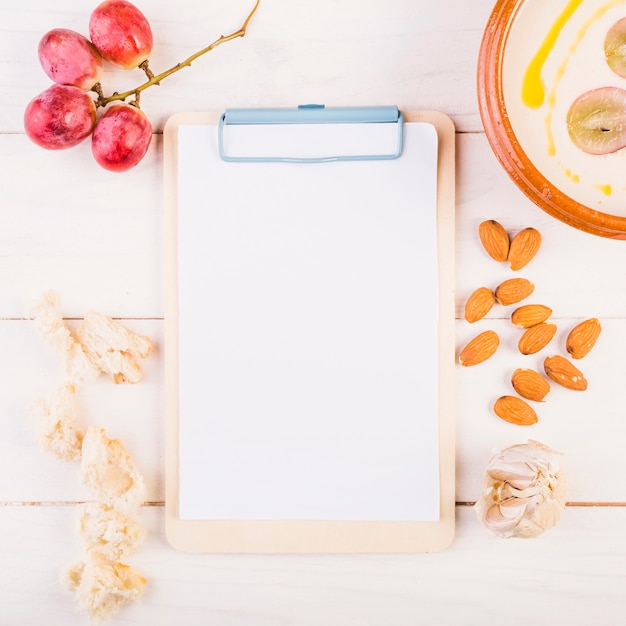 Clipboard with food on kitchen table