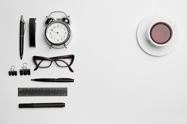 Free Photo the clock, pen, and glasses on white