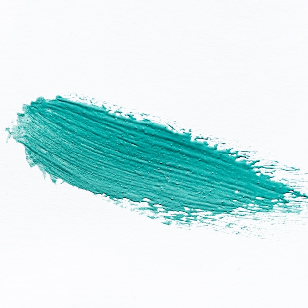 Free photo close-up of abstract blue paint brush stroke on surface