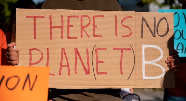 Free photo close up activists protesting with placards