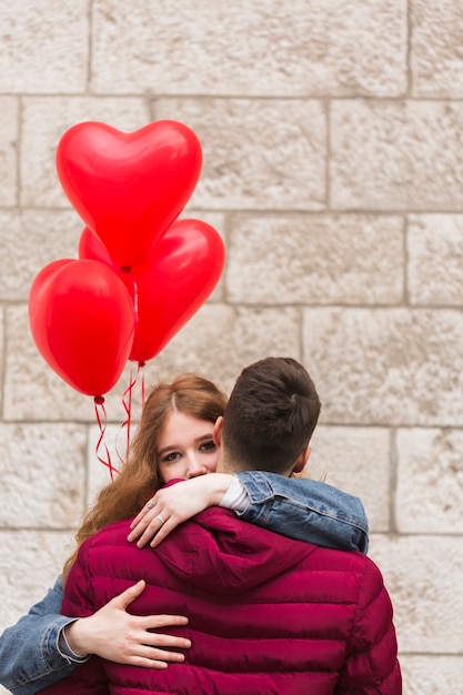 Close up of adorable couple hugging