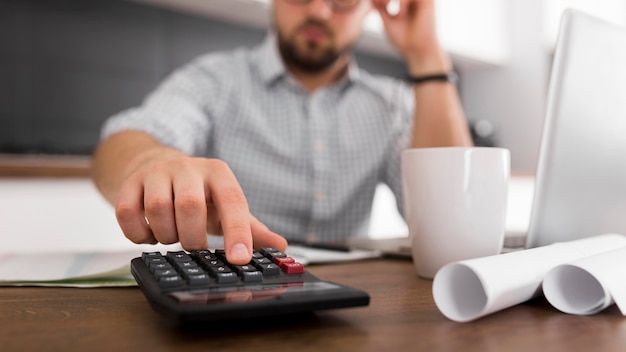 Free photo close-up adult male working from home