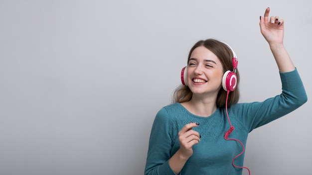 Close-up adult woman enjoying good music