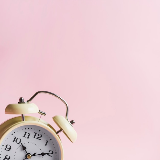 Free photo close-up of alarm clock against pink background