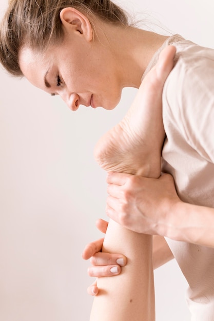 Close-up ankle massage concept