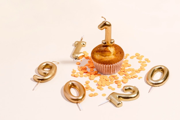 Close-up anniversary cupcake on table