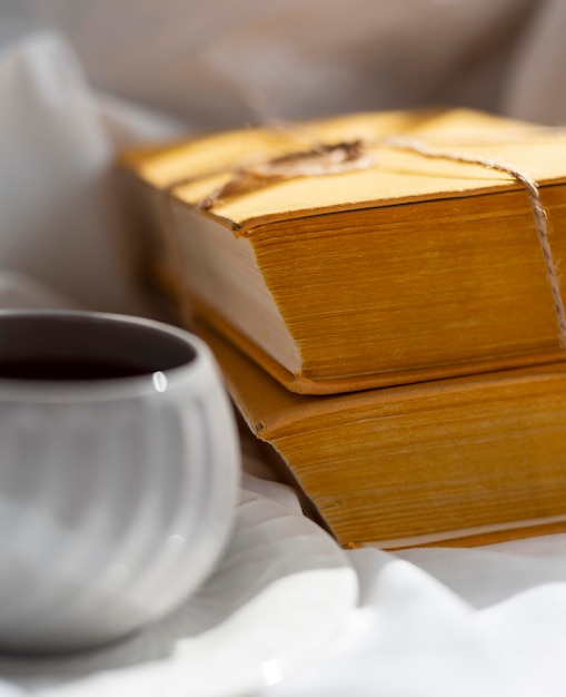 Close up arrangement with books and cup