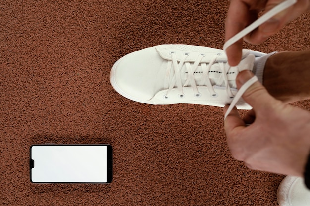 Free Photo close-up athlete tying shoelaces