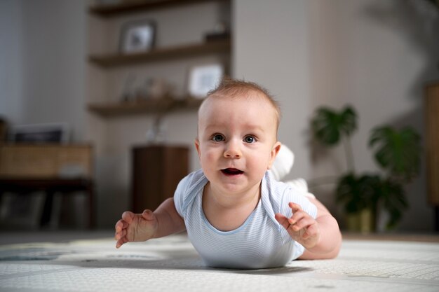 Close up on baby crawling and learning to walk