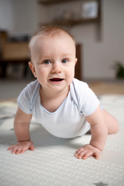 Free photo close up on baby crawling and learning to walk