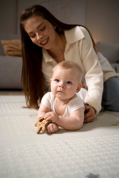 Close up on baby crawling and learning to walk