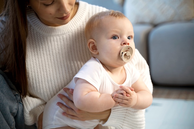 Close up on baby crawling and learning to walk