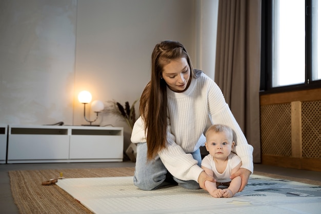 Close up on baby crawling and learning to walk