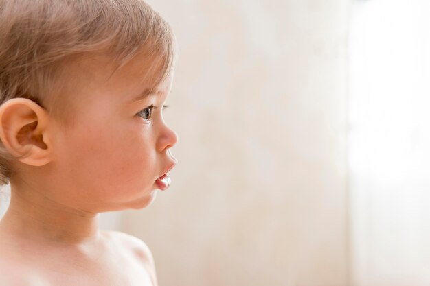 Close-up baby looking away