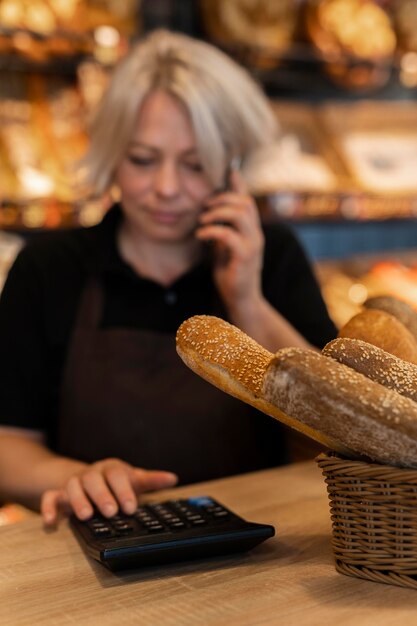 Close up on baker talking with a client