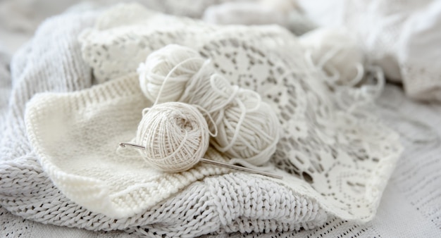 Close-up of balls of yarn for knitting in pastel colors.