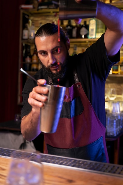 Free photo close up on bartender and cocktail shaker