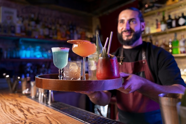 Close up on bartender and cocktail shaker