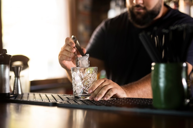 Free Photo close up on bartender creating delicious drink