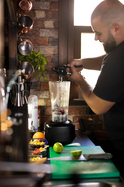 Close up on bartender creating delicious drink