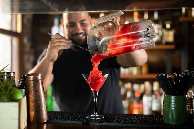 Free Photo close up on bartender creating delicious drink