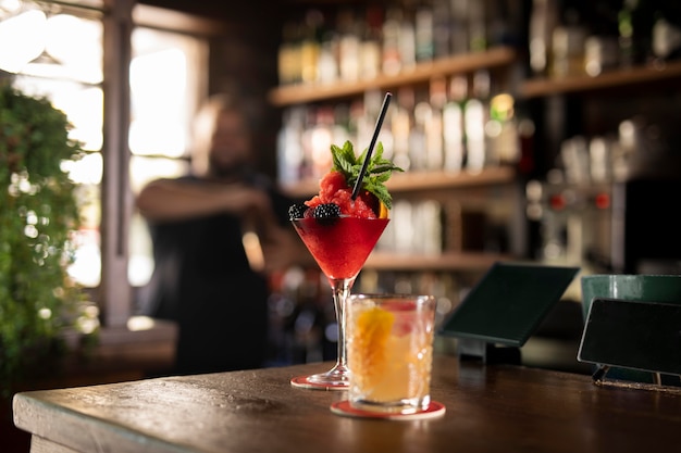 Close up on bartender creating delicious drink