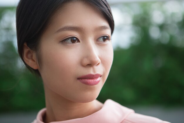 Close up of Beautiful Content Young Asian Woman