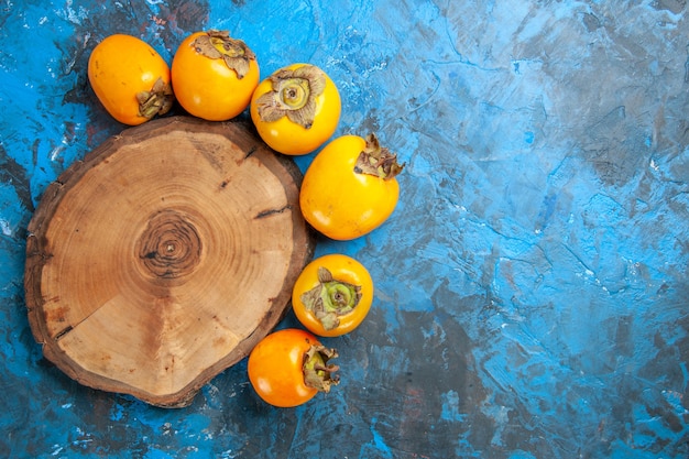 Free Photo close up on beautiful diospyros kaki fruits