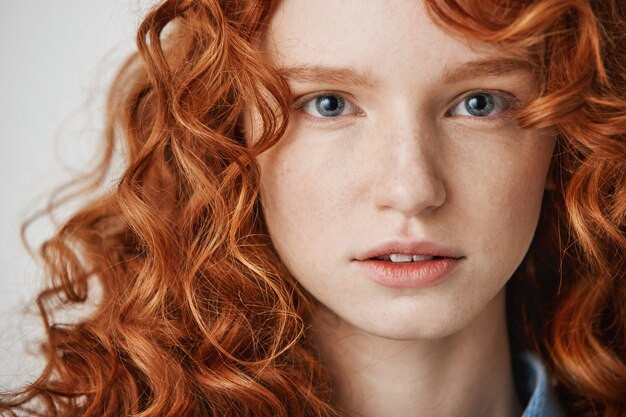 Close up of beautiful natural ginger girl with freckles