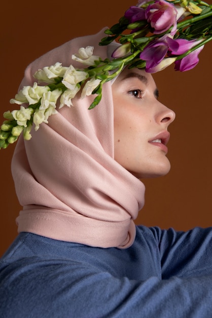 Close up beautiful woman posing with flowers