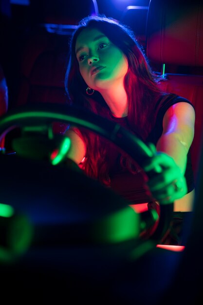 Close up on beautiful young woman driving