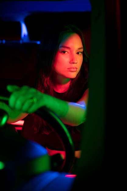 Close up on beautiful young woman driving