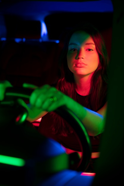 Free photo close up on beautiful young woman driving