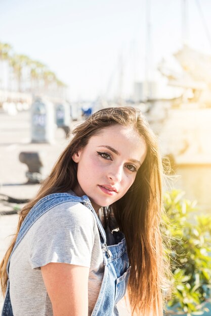 Close-up of a beautiful young woman looking at camera