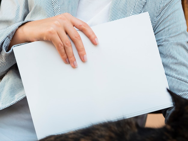 Free photo close-up blank magazine held by a woman