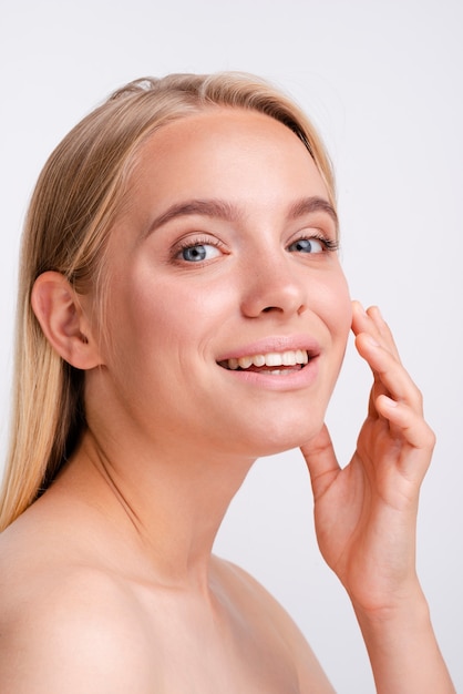 Free Photo close-up blonde woman smiling with white background