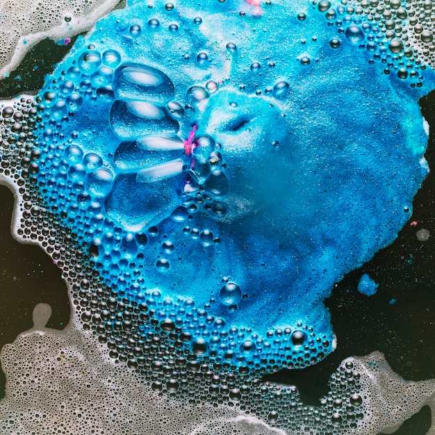 Close-up blue dye on dirty water