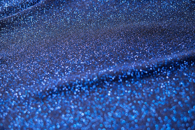 Free photo close up on blue sparks and glitter