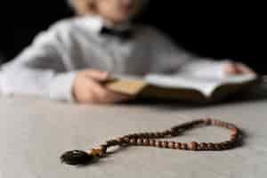 Free photo close up blurry kid holding bible