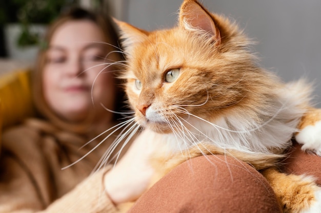 Close up blurry woman with cat