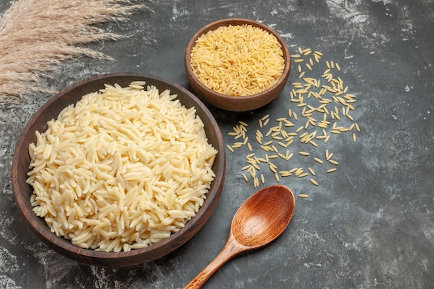 Close up on boiled rice in a brown wooden pot